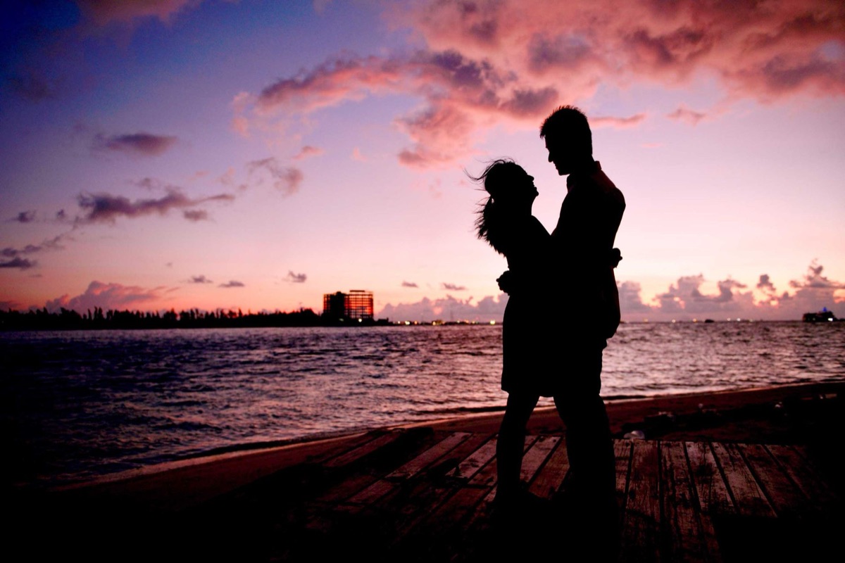 Couple on beach at sunset