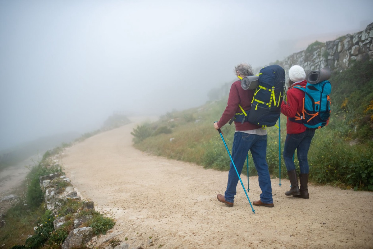couple walking along a secluded island path