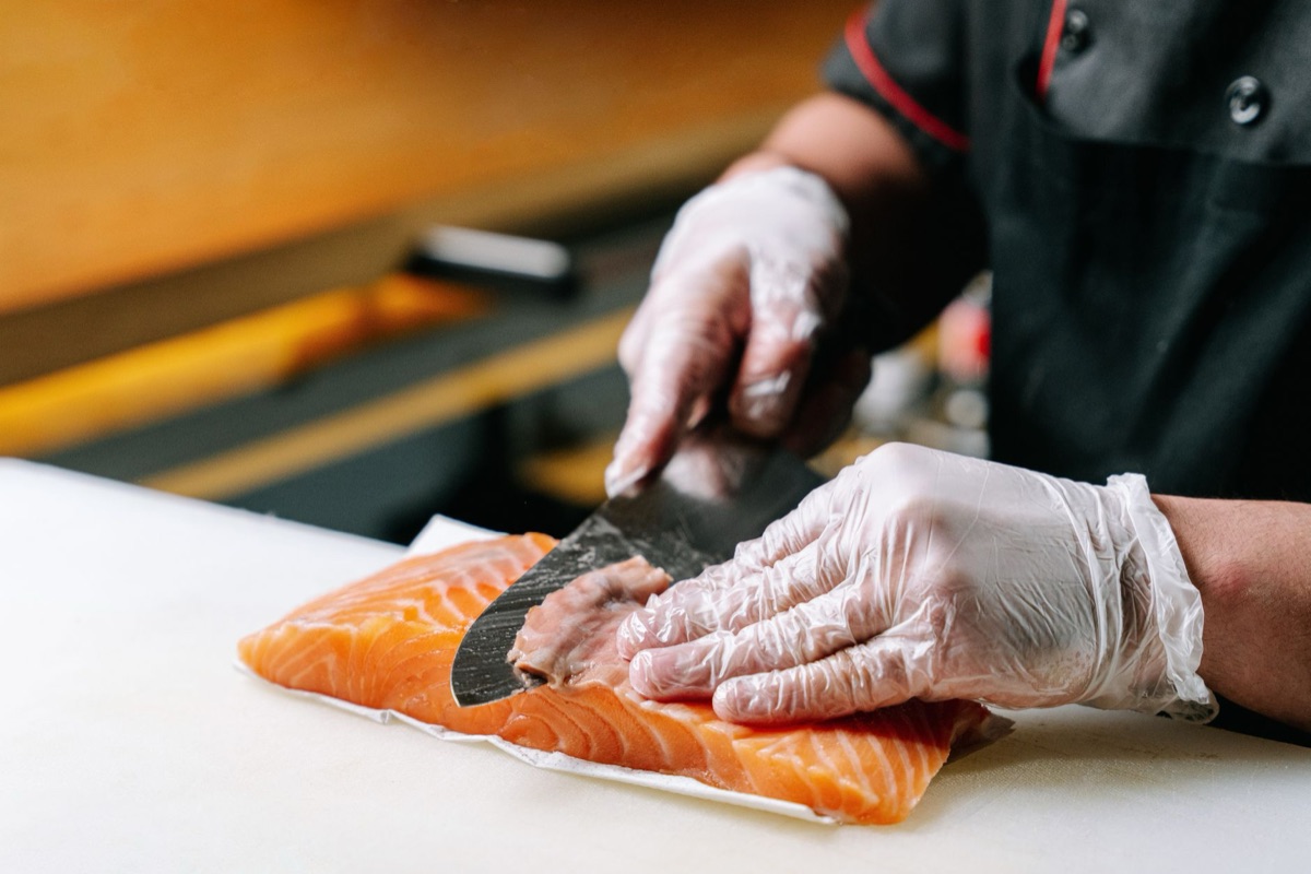 Fiji chef preparing fresh fish dish