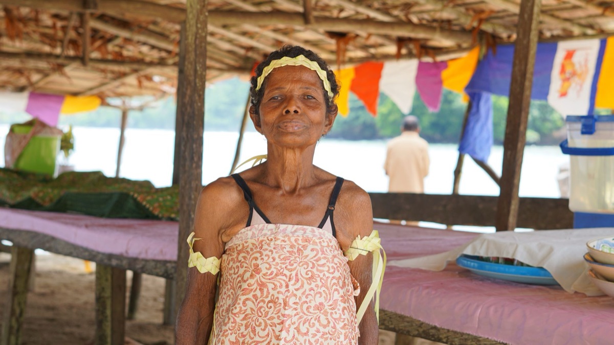 Fijian elder greeting visitor