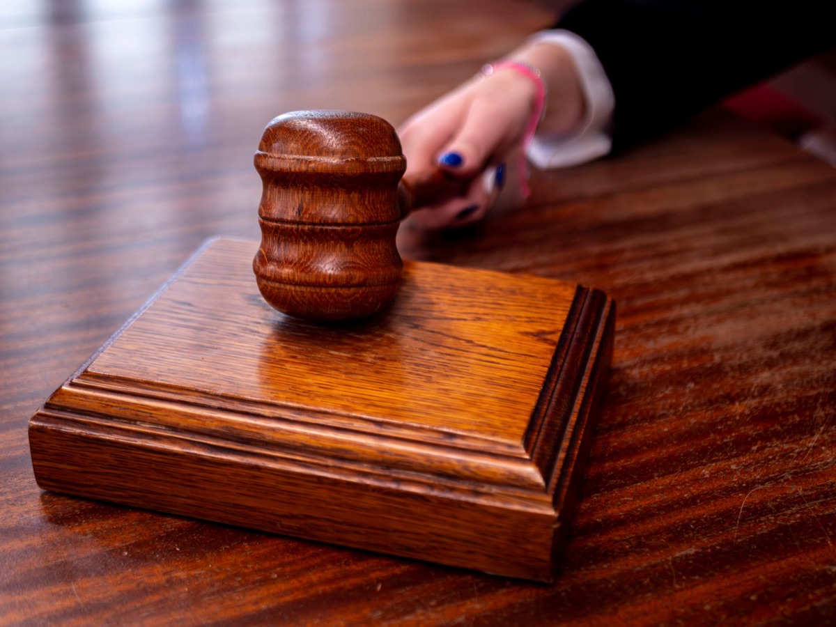wooden courtroom with judge's bench and gavel
